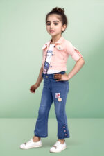 a girl standing in a pink shirt and blue jeans