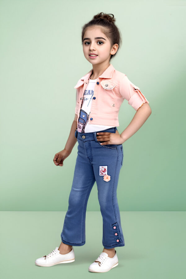 a girl standing in a pink shirt and blue jeans